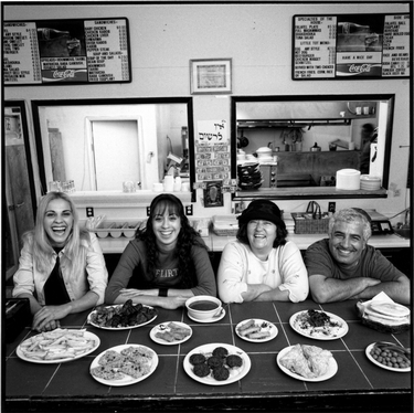 Photograph of Jerusalem Restaurant owners Nina and Yossi (Joseph) Elmalih, and Nina's neices, Hanni Logasy and Hanni Zohar.