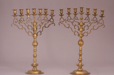 Two brass temple menorahs
