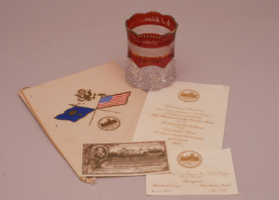 Banquet booklet, souvenir cup, banquet invitation and admission card, and ticket to the South Carolina Inter-State and West Indian Exposition, Charleston, S.C., 1902